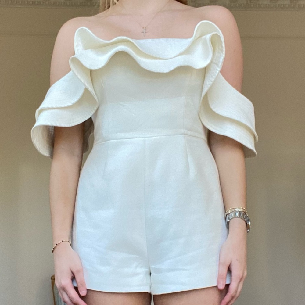 C/MEO Collective white romper with ruffles. Off the shoulder
